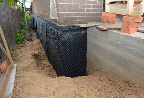 SJ Waterproofing Pros technician performing targeted Emergency Waterproofing assessment in Duncanville, AL